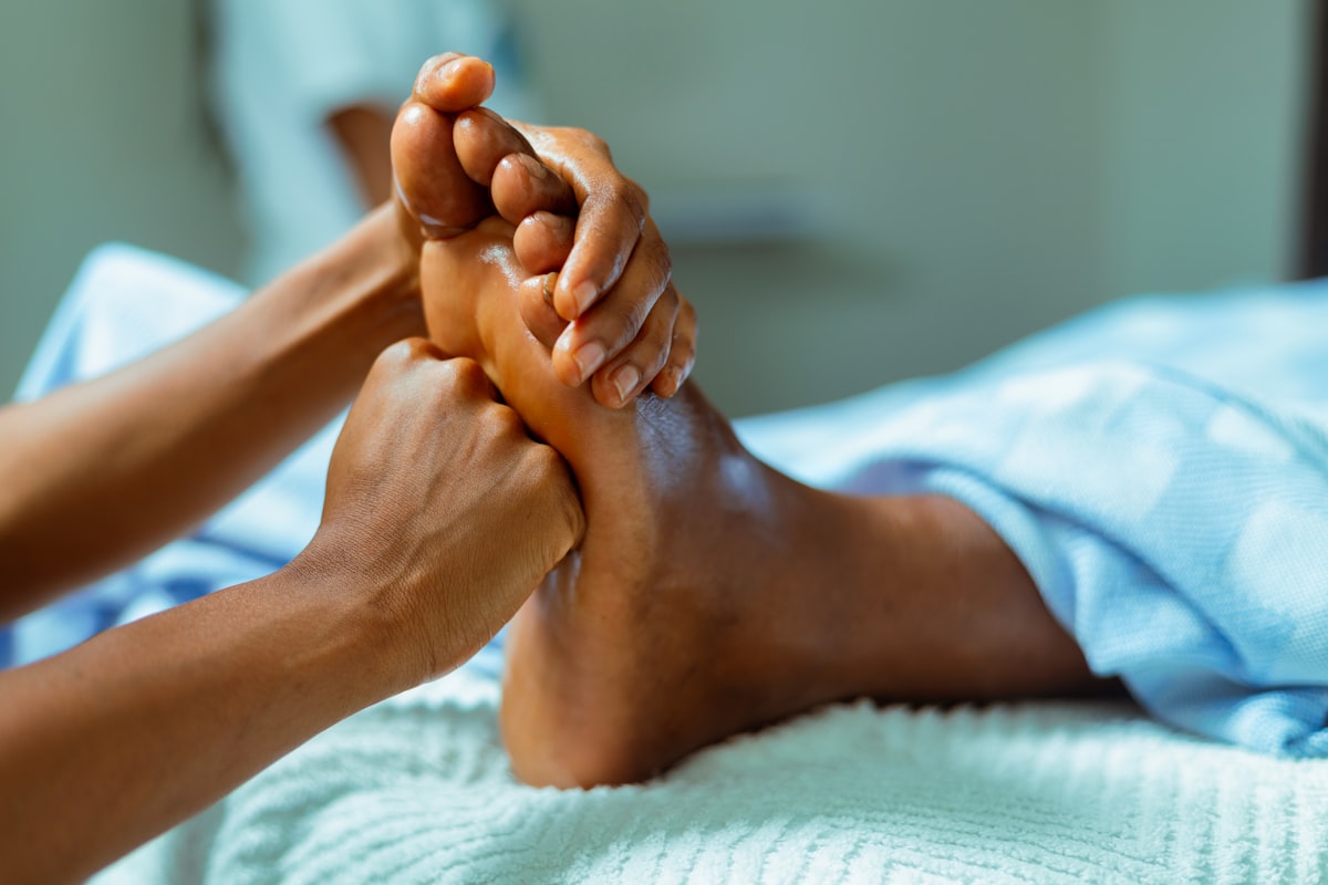 Person relaxing with elevated feet after using massager
